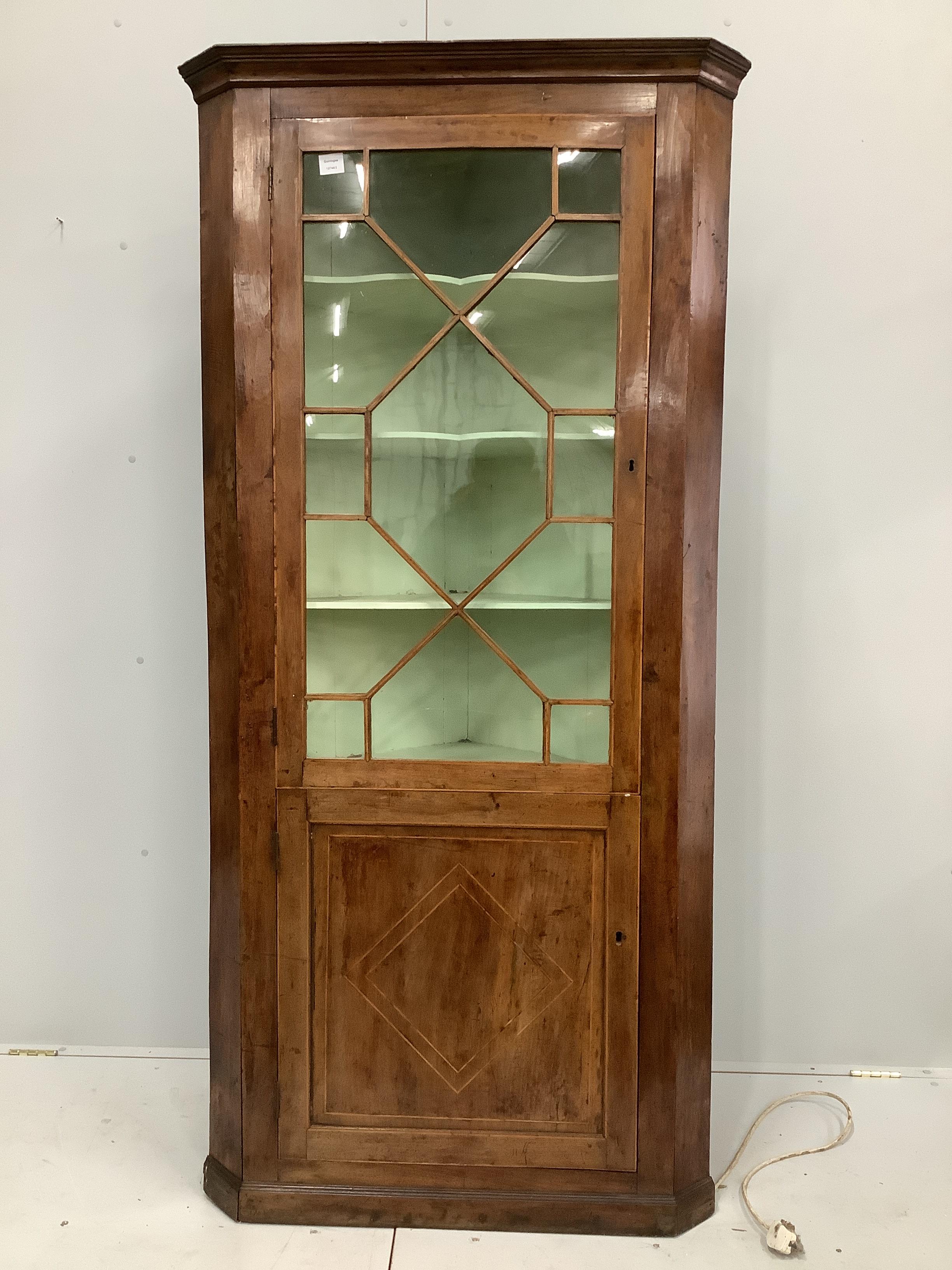 A George III mahogany standing corner cupboard, width 93cm, depth 50cm, height 198cm